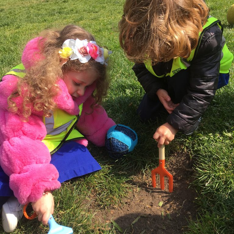 children digging grass