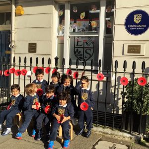 children wearing poppies