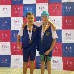 Two Boys in Swimwear, wearing Medals