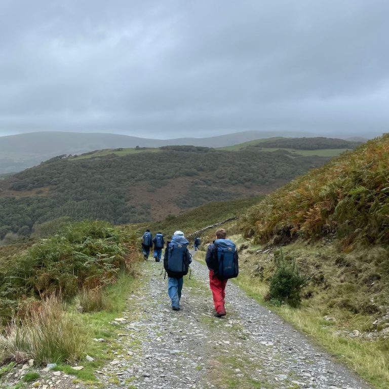 students on a mountain walk