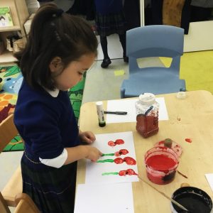 child painting poppies