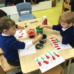 children painting poppies