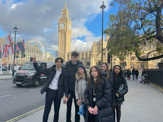 Students in front of Big Ben and the London eye