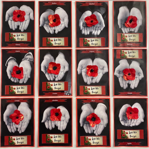 poppies held in different people's hands, displayed on the wall