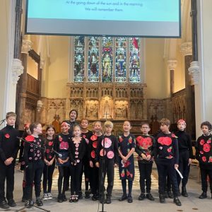 students stood in a cathedral ready to sing