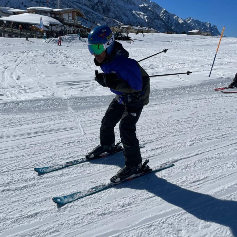student skiing down a slope
